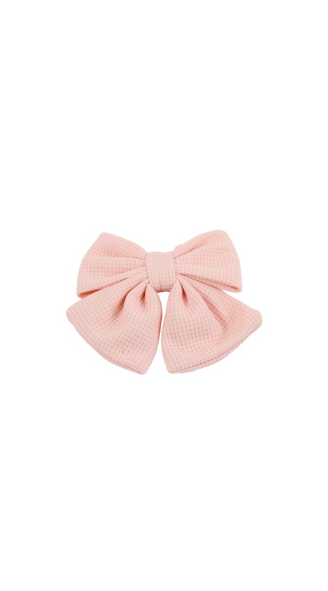 Light pink fabric bow with center knot, layered loops, no clip visible