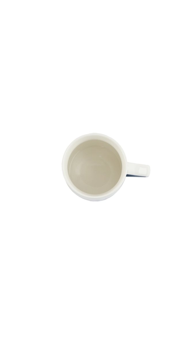 Ceramic cup with handle, inside view with smooth light glaze.