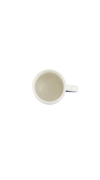 Ceramic cup with handle, inside view with smooth light glaze.