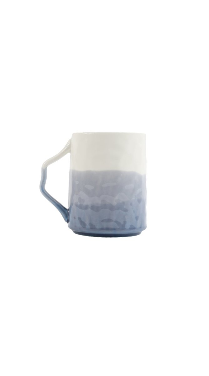 Ceramic cup with ombre blue gradient, wide rim and side handle, white top.