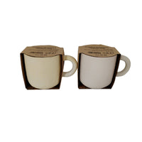 Ceramic cups in packaging, cream cups with visible pink or dark interiors