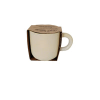 Ceramic cup in box, cream exterior with dark pink interior and side handle