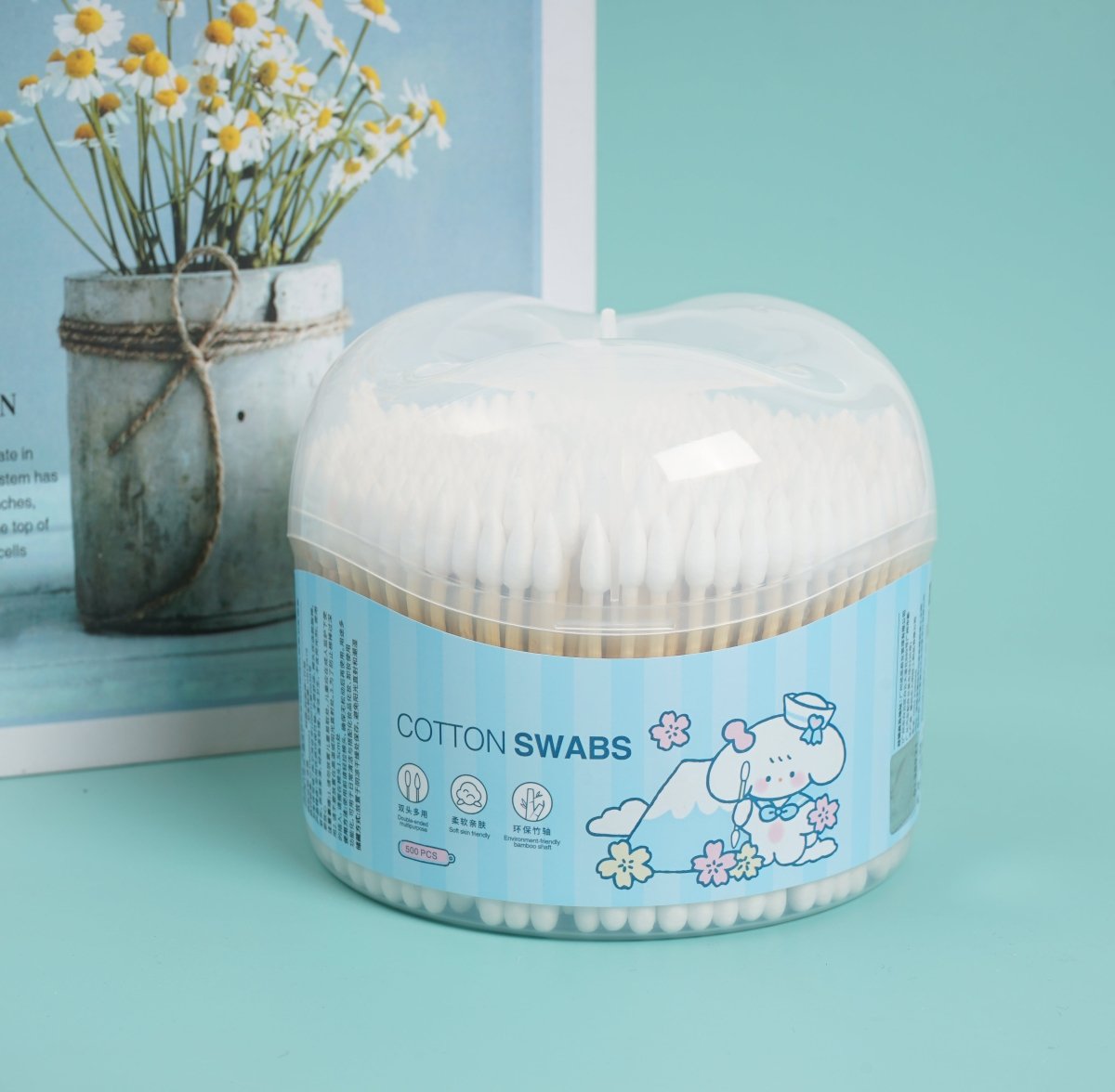 Cotton swabs dispenser with clear dome lid and white swabs, blue label