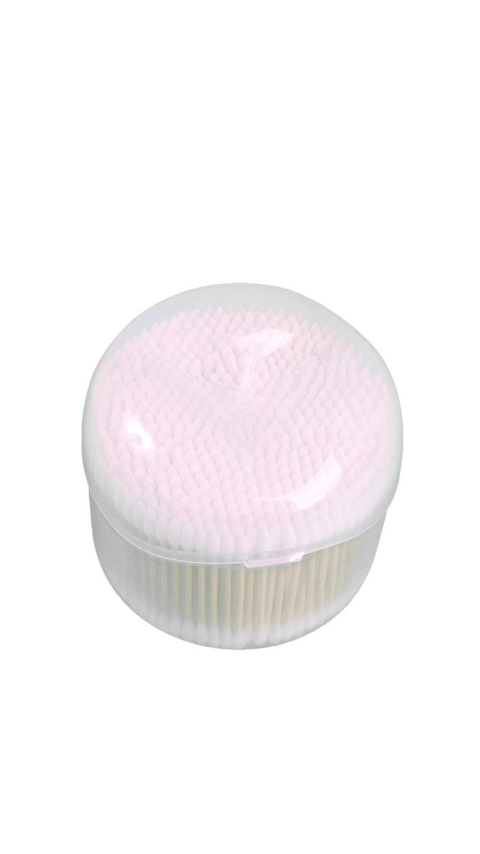 Cotton swabs dispenser with white swabs packed under a clear dome lid