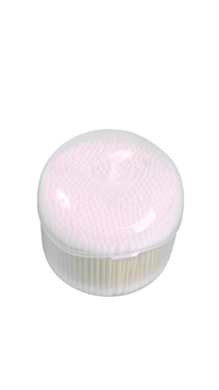 Cotton swabs dispenser with white swabs packed under a clear dome lid