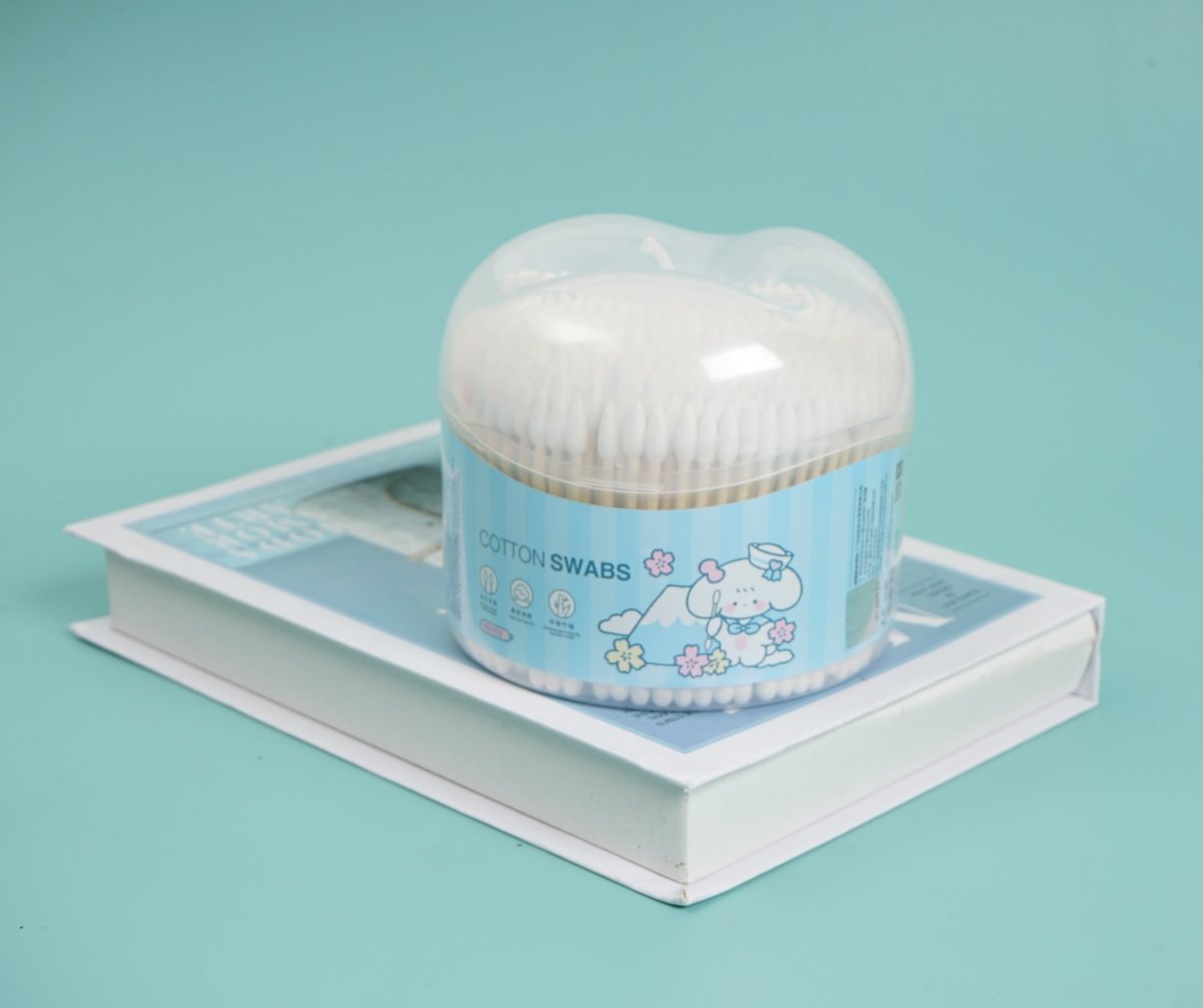 Cotton swabs dispenser on tray with clear dome lid and white swabs
