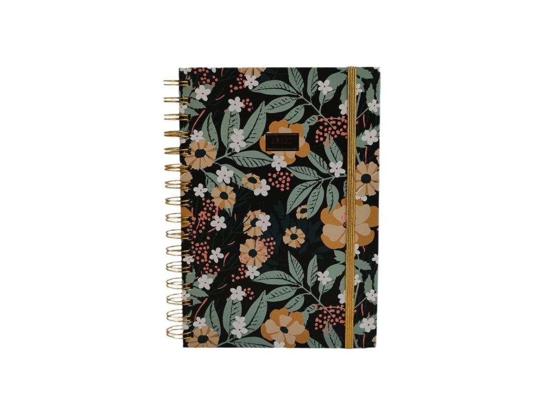 Hardcover spiral notebook, floral cover with gold ring binding, straight-on view.