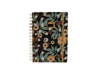 Hardcover spiral notebook, floral cover with gold ring binding, straight-on view.