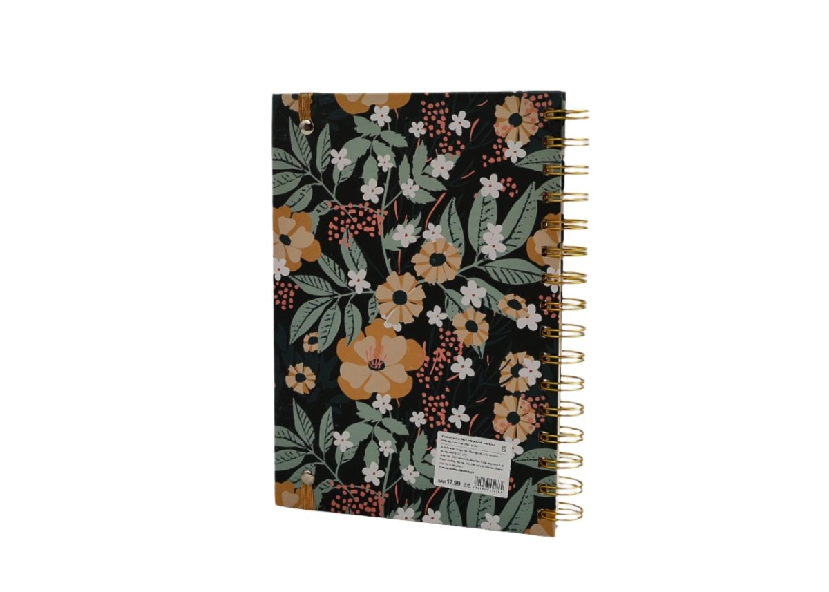 Hardcover spiral notebook with floral cover and gold spiral rings, logo patch on front.