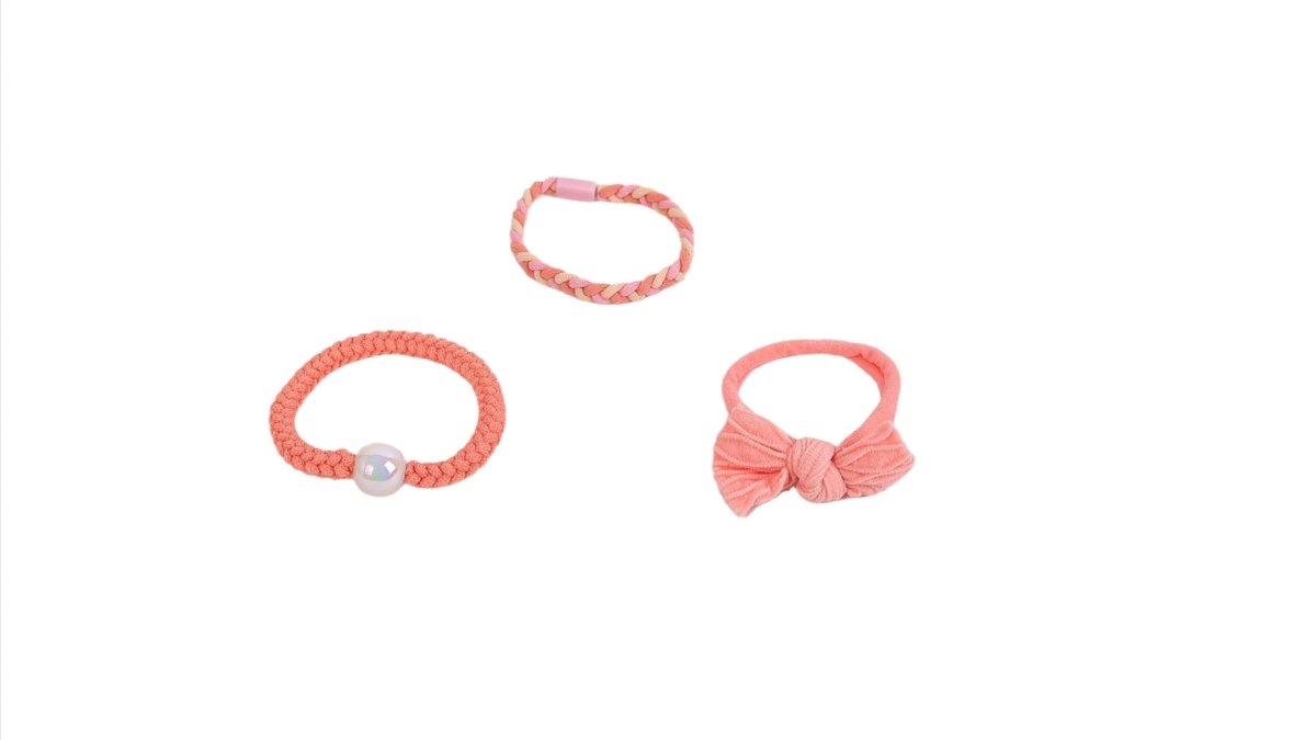 Pink and coral braided hair ties and bracelets with bead and bow accents