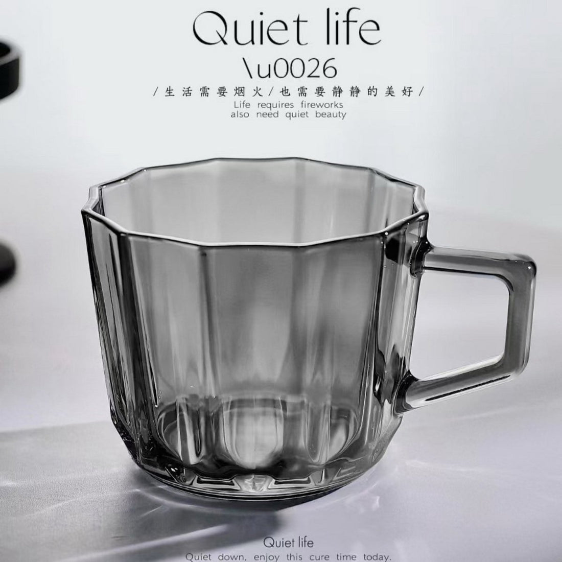 Clear faceted glass cup with handle and wide opening