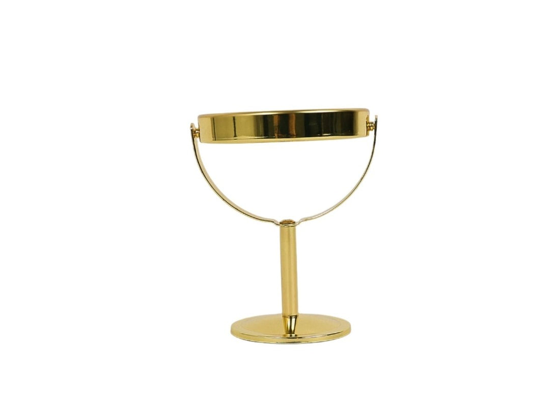 Gold tabletop makeup mirror with rounded top bar and circular base