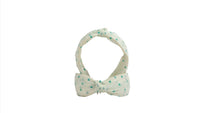 Polka dot bow headband with mint dots on light fabric band