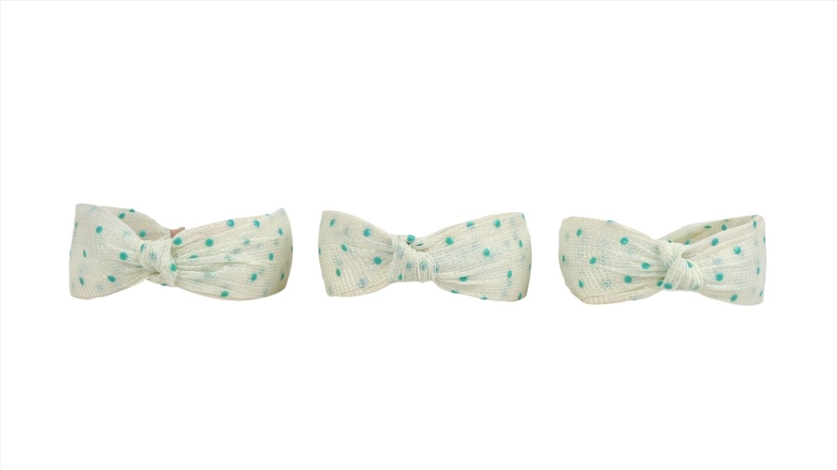 Three polka dot bow headbands in light fabric with mint dots
