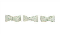 Three polka dot bow headbands in light fabric with mint dots