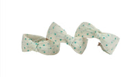 Bow headband with polka dot pattern, mint dots on light fabric