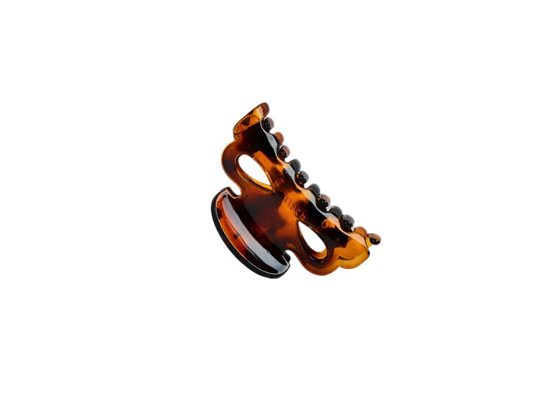 Brown hair claw clip with curved, ridged grip teeth