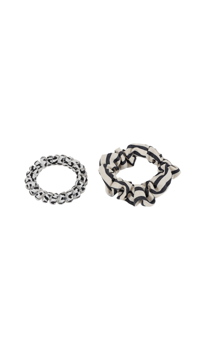 Two hair ties: black-and-cream interwoven band and black-and-cream striped scrunchie