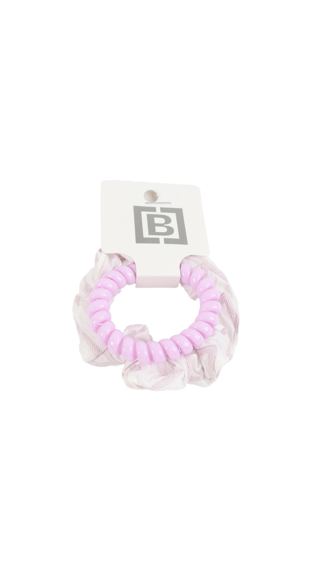 Lavender scrunchie-style hair tie with ruffled texture and tag