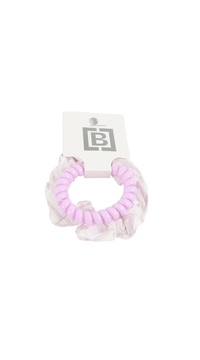 Lavender scrunchie-style hair tie with ruffled texture and tag