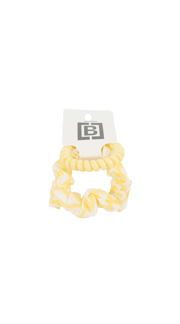 Yellow scrunchie-style hair tie with ruffled texture and tag