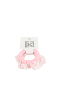 Pink scrunchie-style hair tie with ruffled texture and tag
