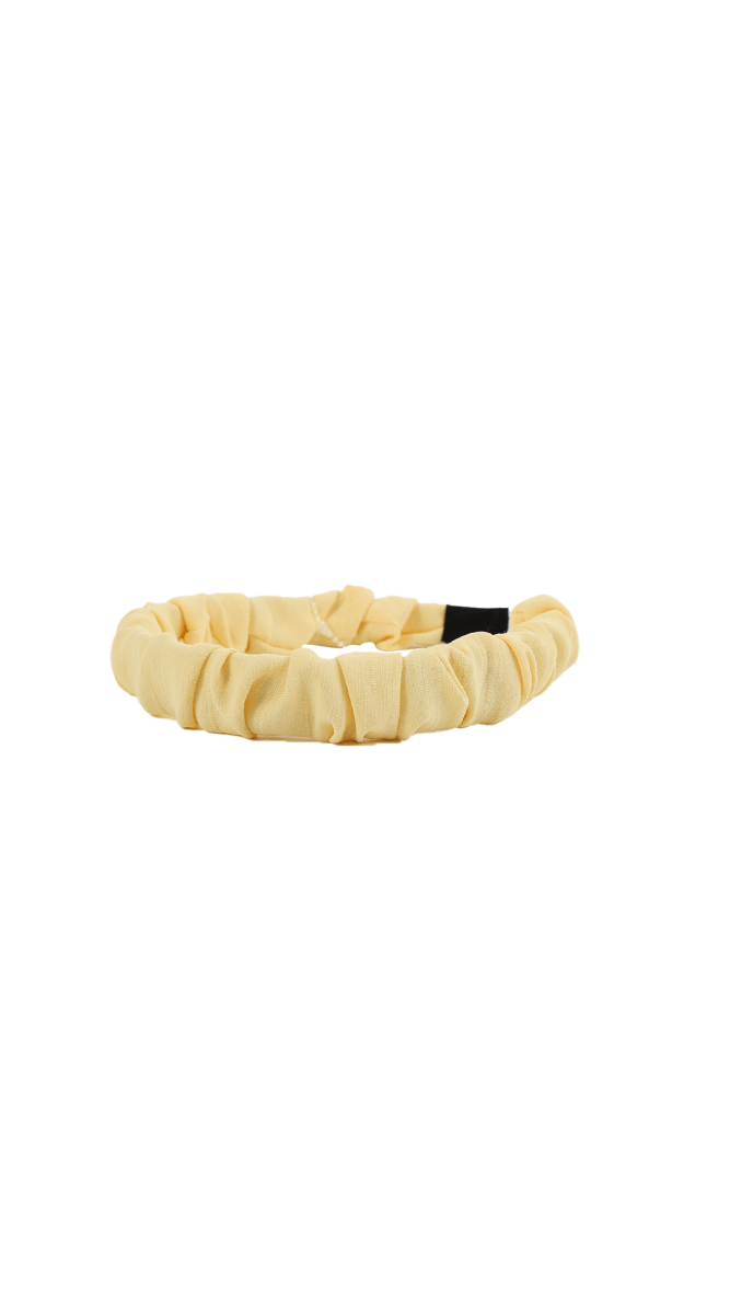 Cream ruffled headband with black tapered ends