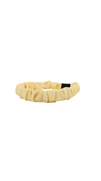 Cream ruffled headband with black tapered ends