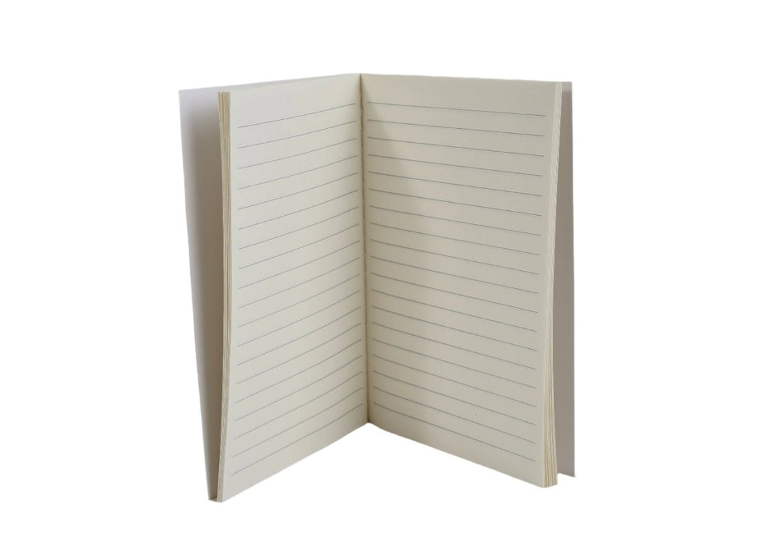 A6 lined notebook open to inner pages with horizontal ruled lines