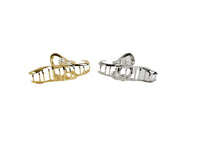 Gold and silver hair clips with pearl accents and comb-like teeth detail