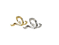 Gold and silver hair clips with pearl accents and swirl loop frames