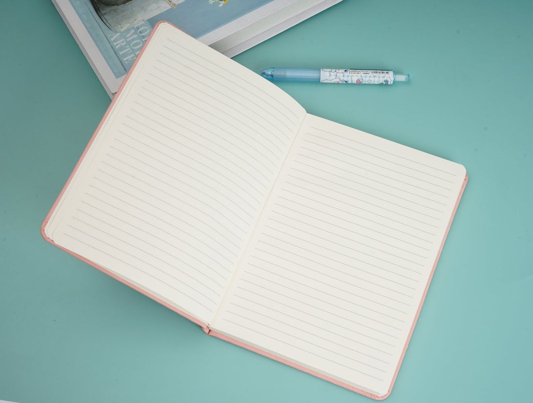 A5 PU notebook open to lined pages, pink cover with purple band
