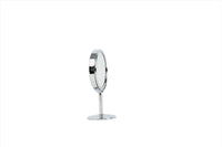 Round makeup mirror with chrome circular frame and pedestal base, angled profile view.