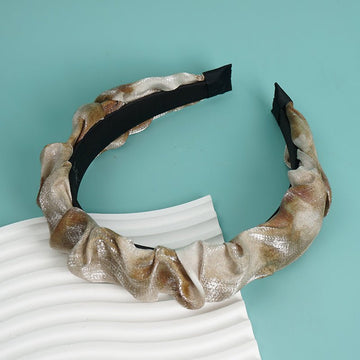 Shiny copper scrunched headband with black inner band, twisted knot detail