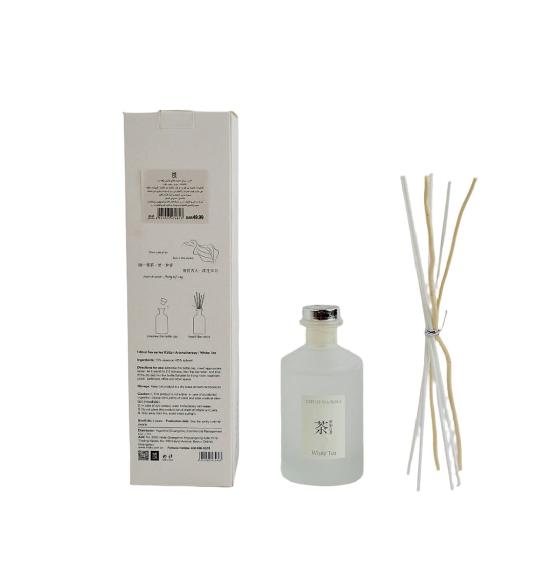 White tea reed diffuser set with glass bottle, label, and reed sticks