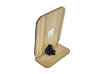 Wooden desk mirror back with label and black mounting hardware on base.