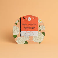 Camellia facial mask sachet with orange front, floral print and face-mask icon