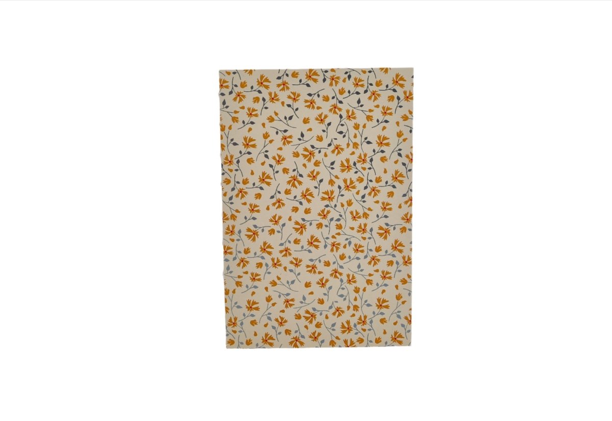 Floral notebook cover with scattered orange flowers on white