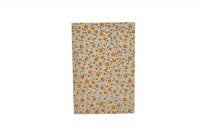 Floral notebook cover with scattered orange flowers on white