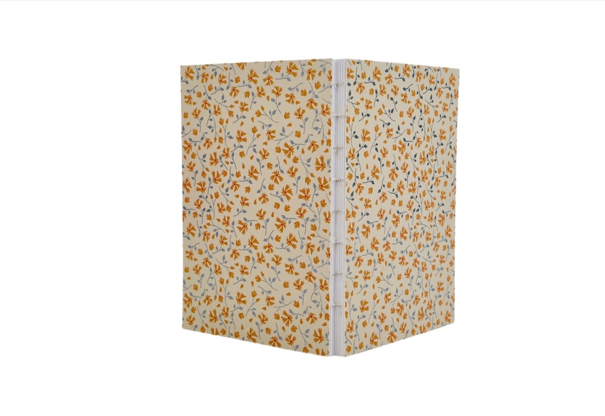 Notebook with floral cover, brown and blue leaf pattern