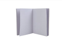 Open notebook with gray lined pages and soft cover