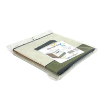 Foldable storage box in plastic packaging, cream and green fabric panels, black trim.