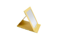 Yellow foldable tabletop mirror with reflective panel