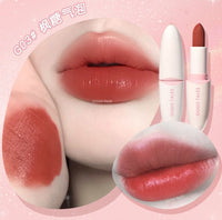 Fouch Up satin lipstick on lips with light pink tubes in view
