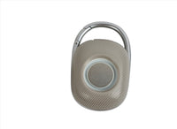 Gray portable wireless speaker with carry handle and circular control button