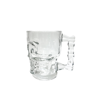 Clear glass skull mug with right handle and sculpted skull base