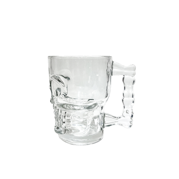 Clear glass skull mug with right handle and sculpted skull base