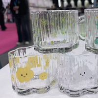 Clear glass mugs with mixed animal and snowflake prints, loop handles
