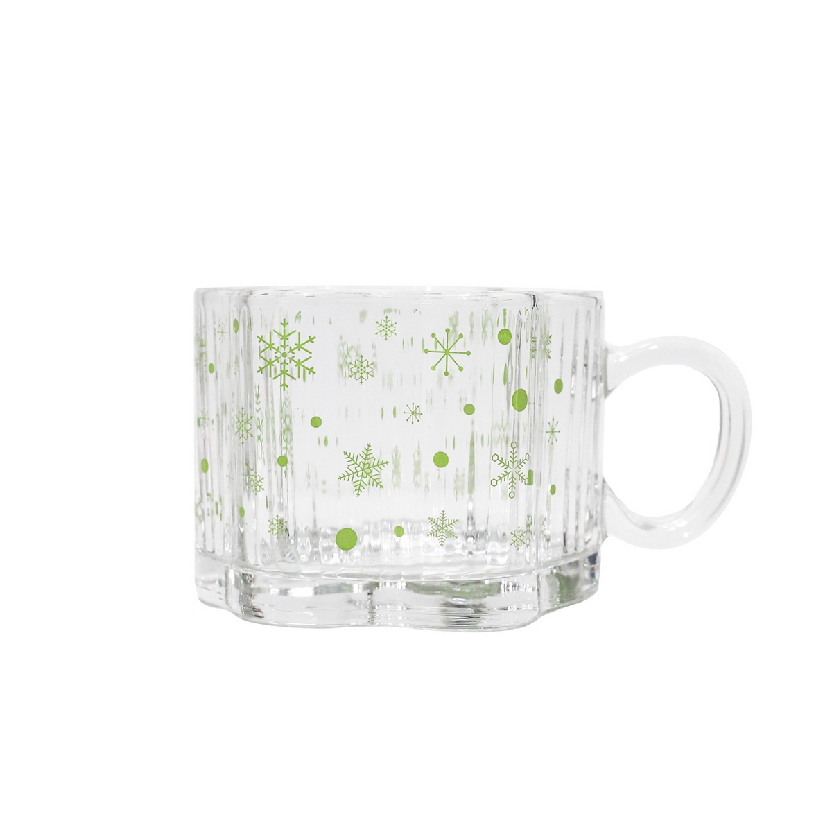 Clear glass mug with green snowflakes and dots, rounded handle