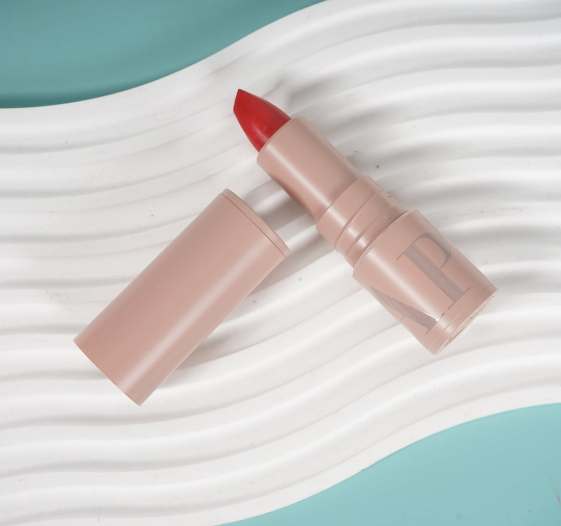Gogo Tales lipstick #G01 with red tip and beige tube, open and capped.